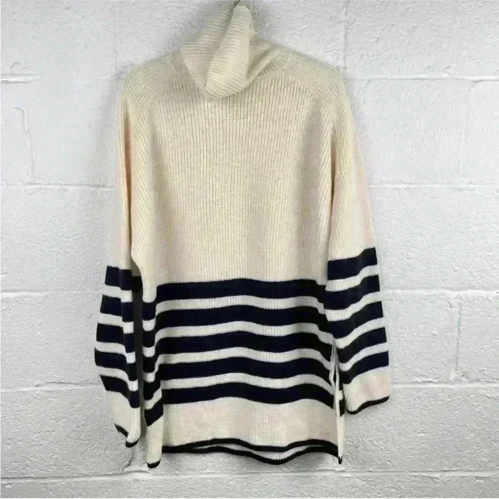 COS Roll neck sweater in white and black striped wool and cotton blend